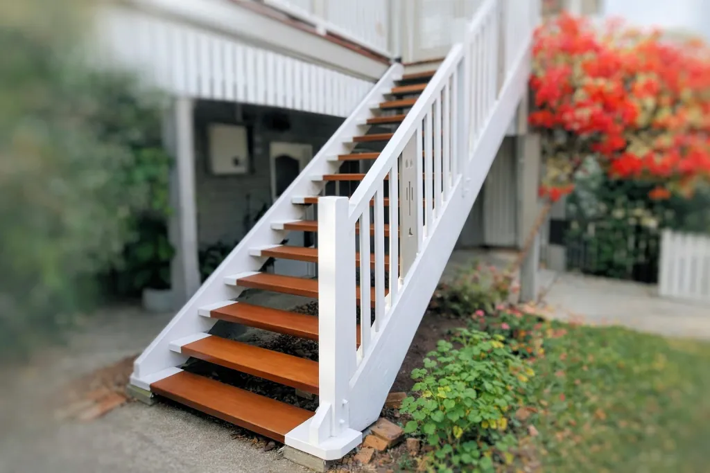 Rebuilt external timber stairs with painted balustrade and handrail, Norman Park