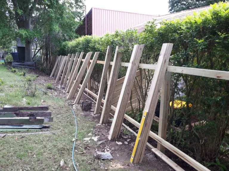 Standard two rail paling fence with palings spread out ready for installation.